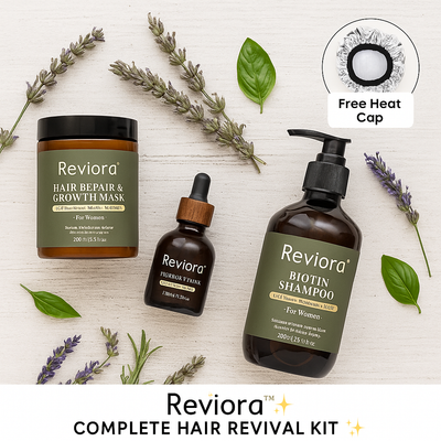 Reviora hair care products including a mask, shampoo, and serum on a light wooden surface with herbs.